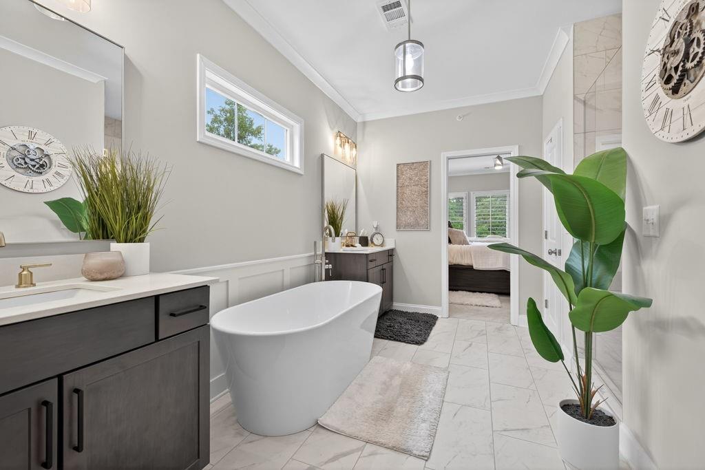 425 Retreat Lane Canton, GA 30114 - Photo 30 of 55 a spacious bathroom with a bathtub sink and mirror