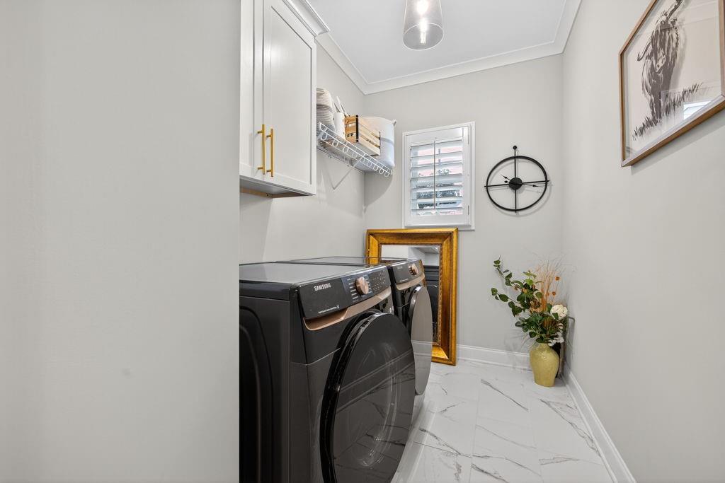 425 Retreat Lane Canton, GA 30114 - Photo 34 of 55 a utility room with dryer and washer