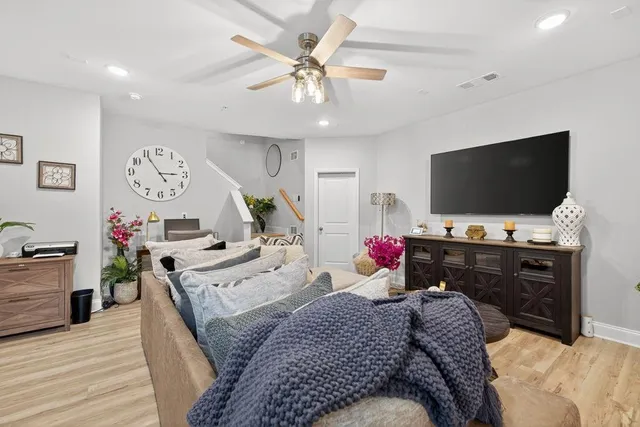 a bedroom with a bed and a flat screen tv in it