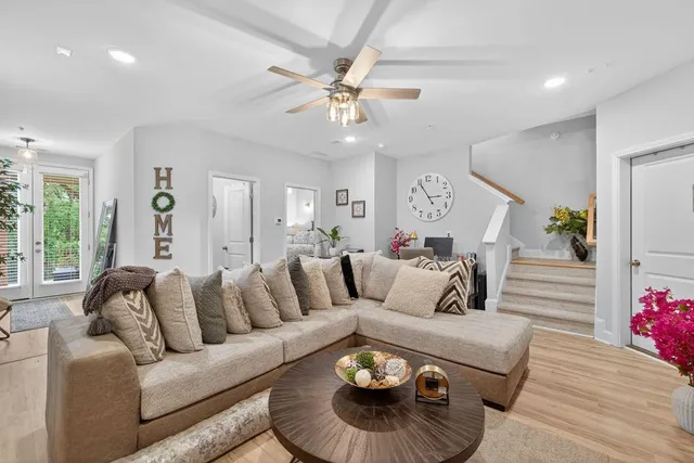 a bathroom with a granite countertop sink a toilet and shower