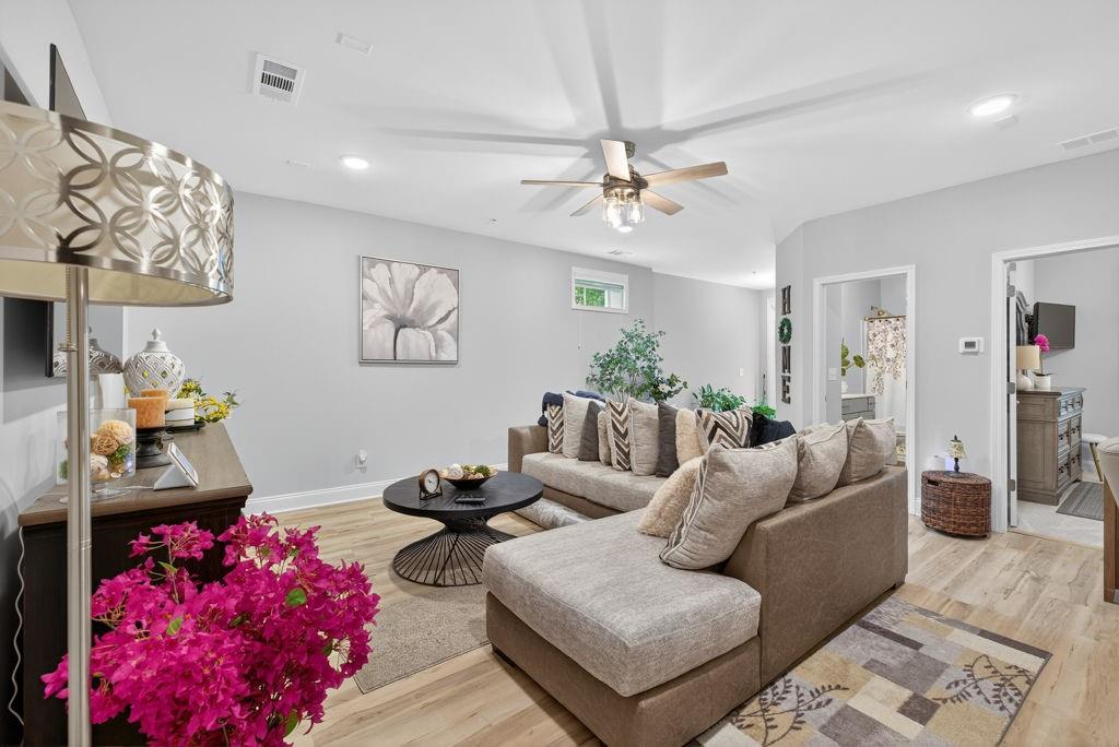 425 Retreat Lane Canton, GA 30114 - Photo 41 of 55 a living room with furniture and a chandelier