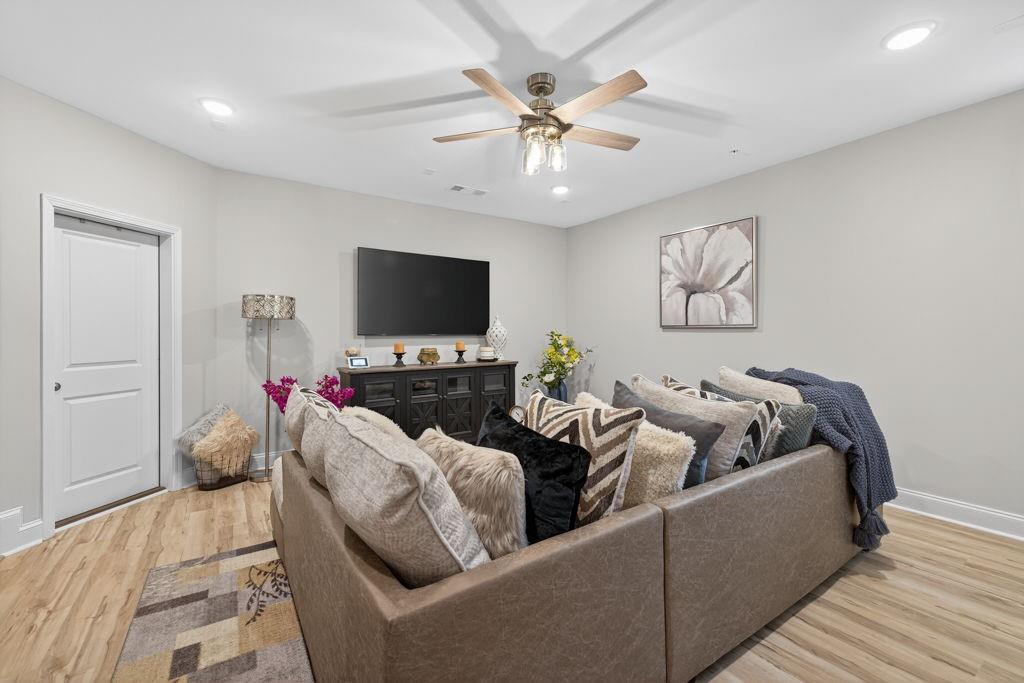 425 Retreat Lane Canton, GA 30114 - Photo 45 of 55 a living room with furniture and a flat screen tv
