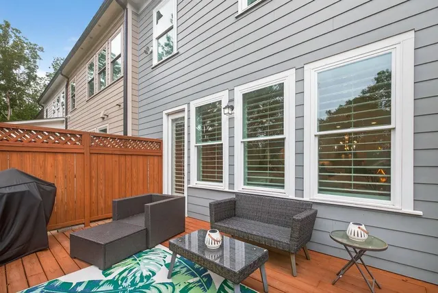 a view of a house with a yard and sitting area