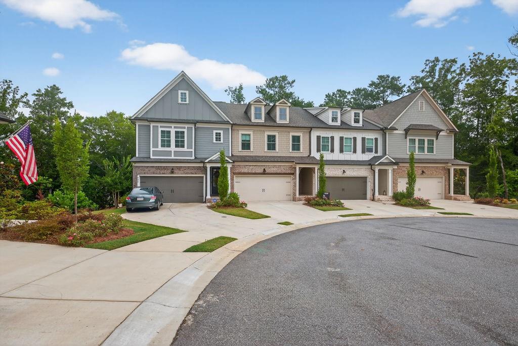 425 Retreat Lane Canton, GA 30114 - Photo 50 of 55 a front view of a house with yard and parking
