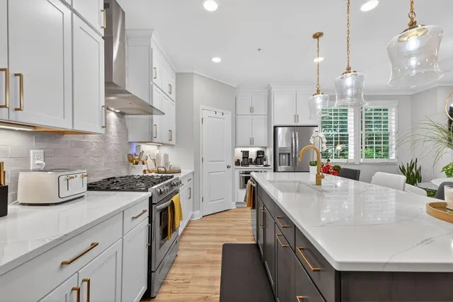 a kitchen with a table and chairs in it