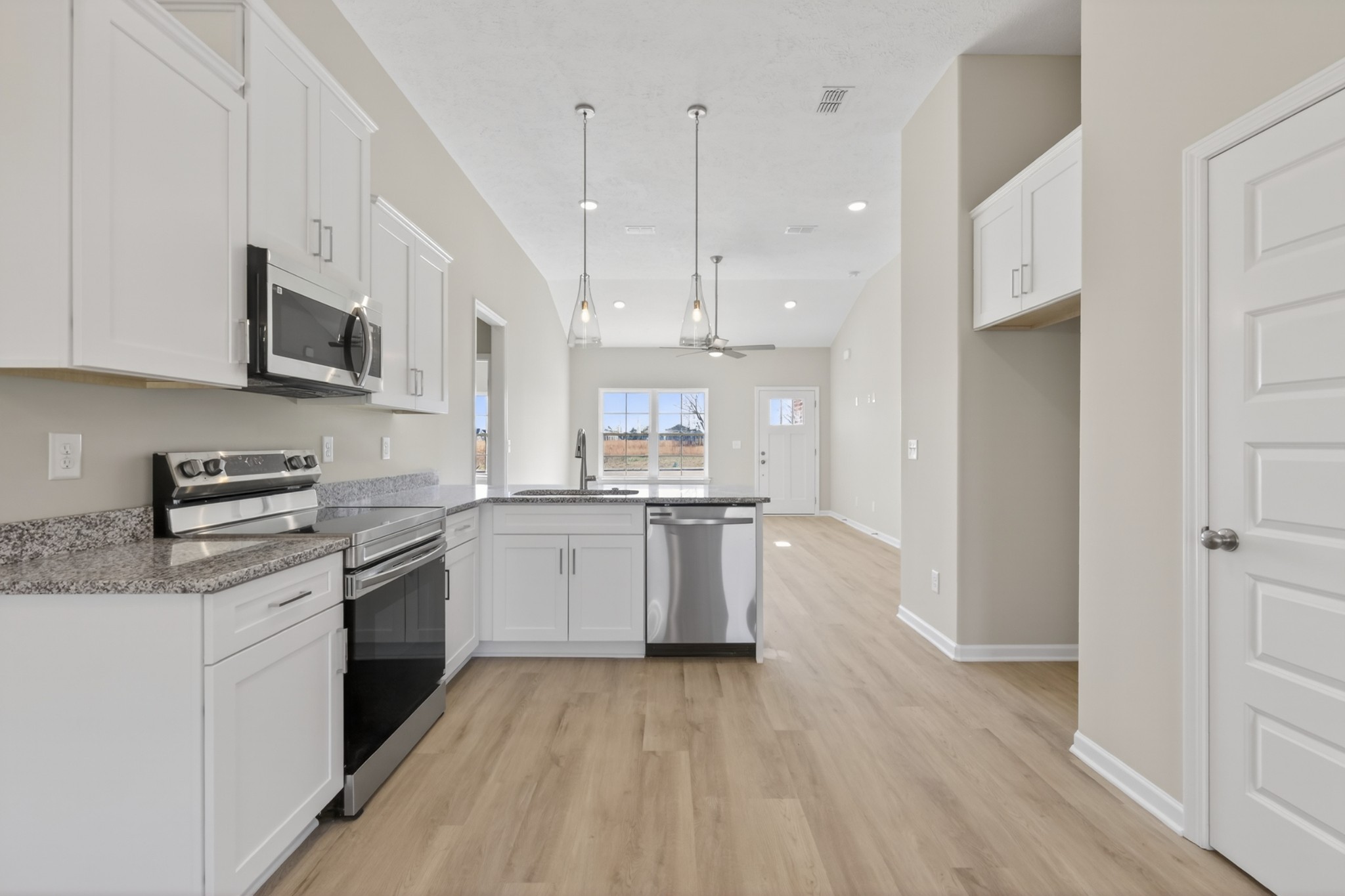 336 North Fork Branch Road Tullahoma, TN 37388 - Photo 13 of 34 a kitchen with a sink window and stainless steel appliances