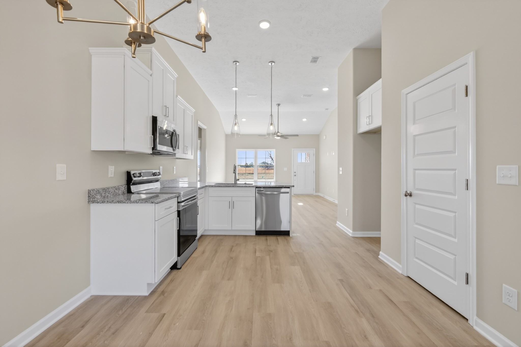 336 North Fork Branch Road Tullahoma, TN 37388 - Photo 14 of 34 a kitchen with white cabinets and stainless steel appliances