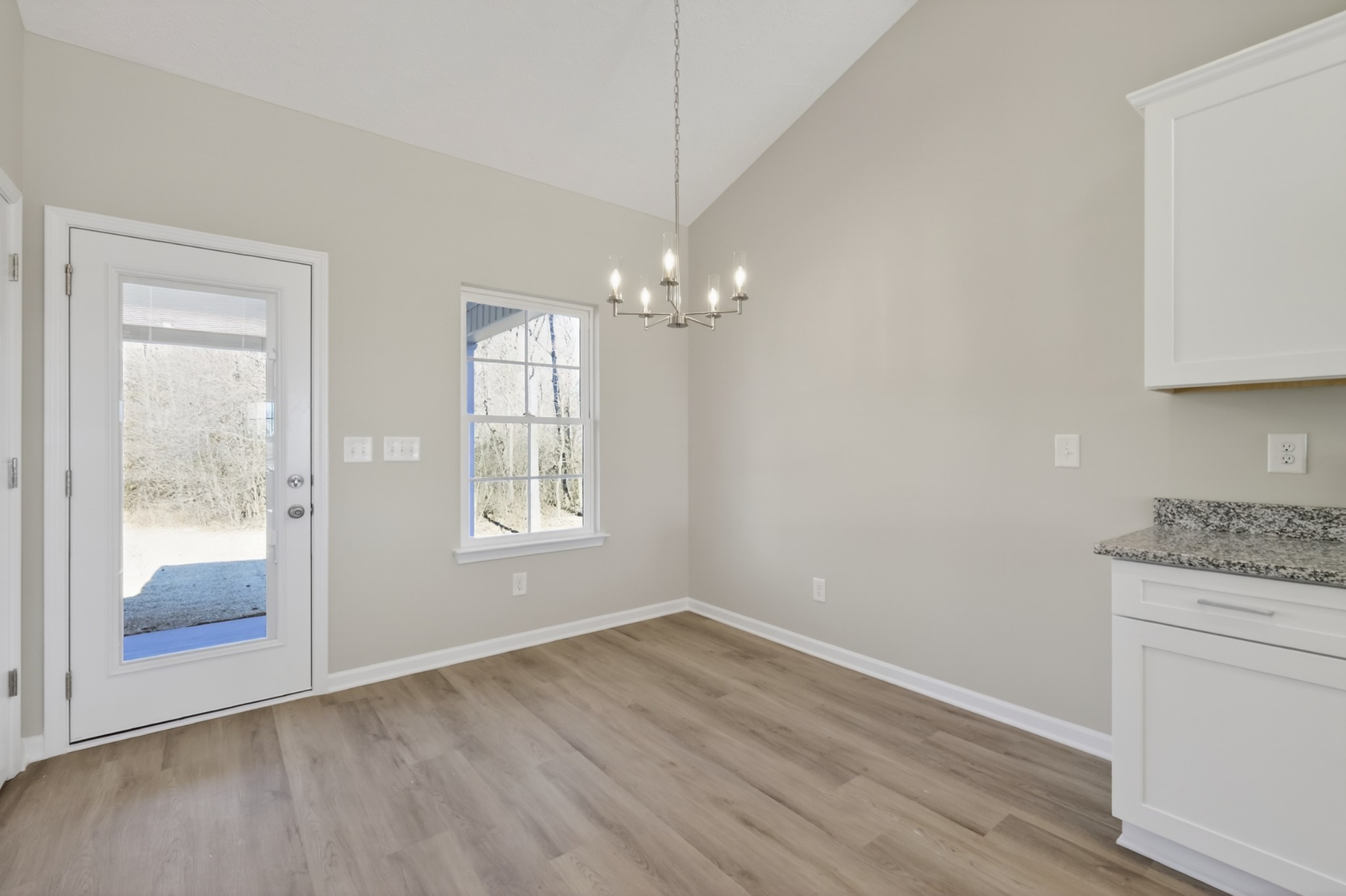 336 North Fork Branch Road Tullahoma, TN 37388 - Photo 16 of 34 a room with a chandelier fan and wooden floor