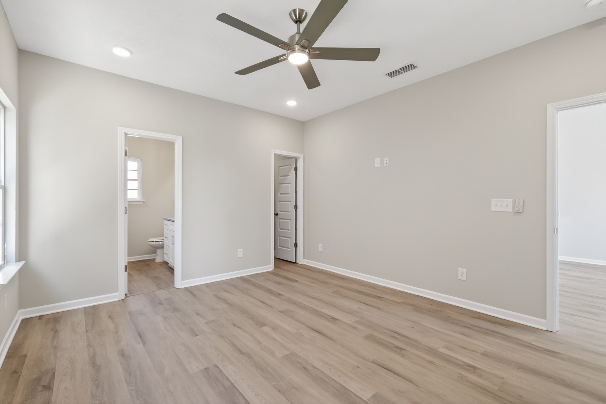 336 North Fork Branch Road Tullahoma, TN 37388 - Photo 18 of 34 an empty room with wooden floor and ceiling fan