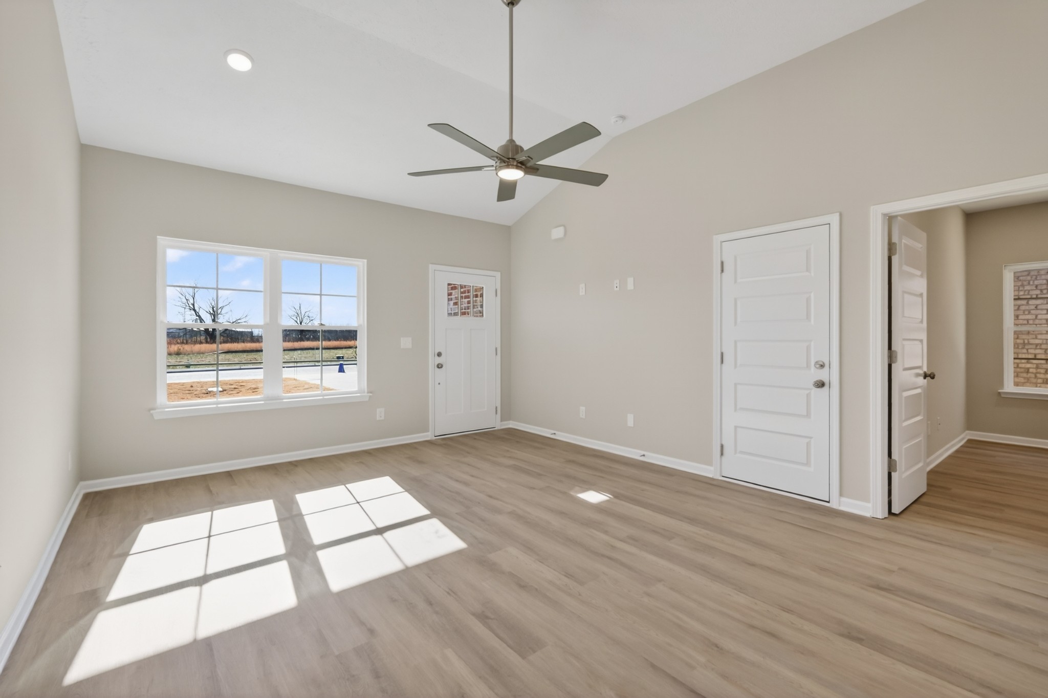 336 North Fork Branch Road Tullahoma, TN 37388 - Photo 6 of 34 wooden floor in an empty room with a window