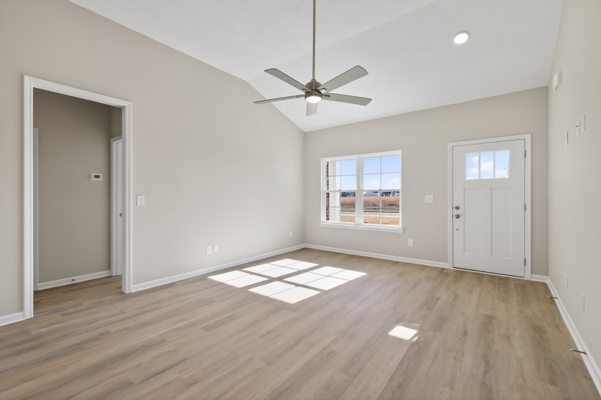 336 North Fork Branch Road Tullahoma, TN 37388 - Photo 7 of 34 a view of an empty room with wooden floor and a window