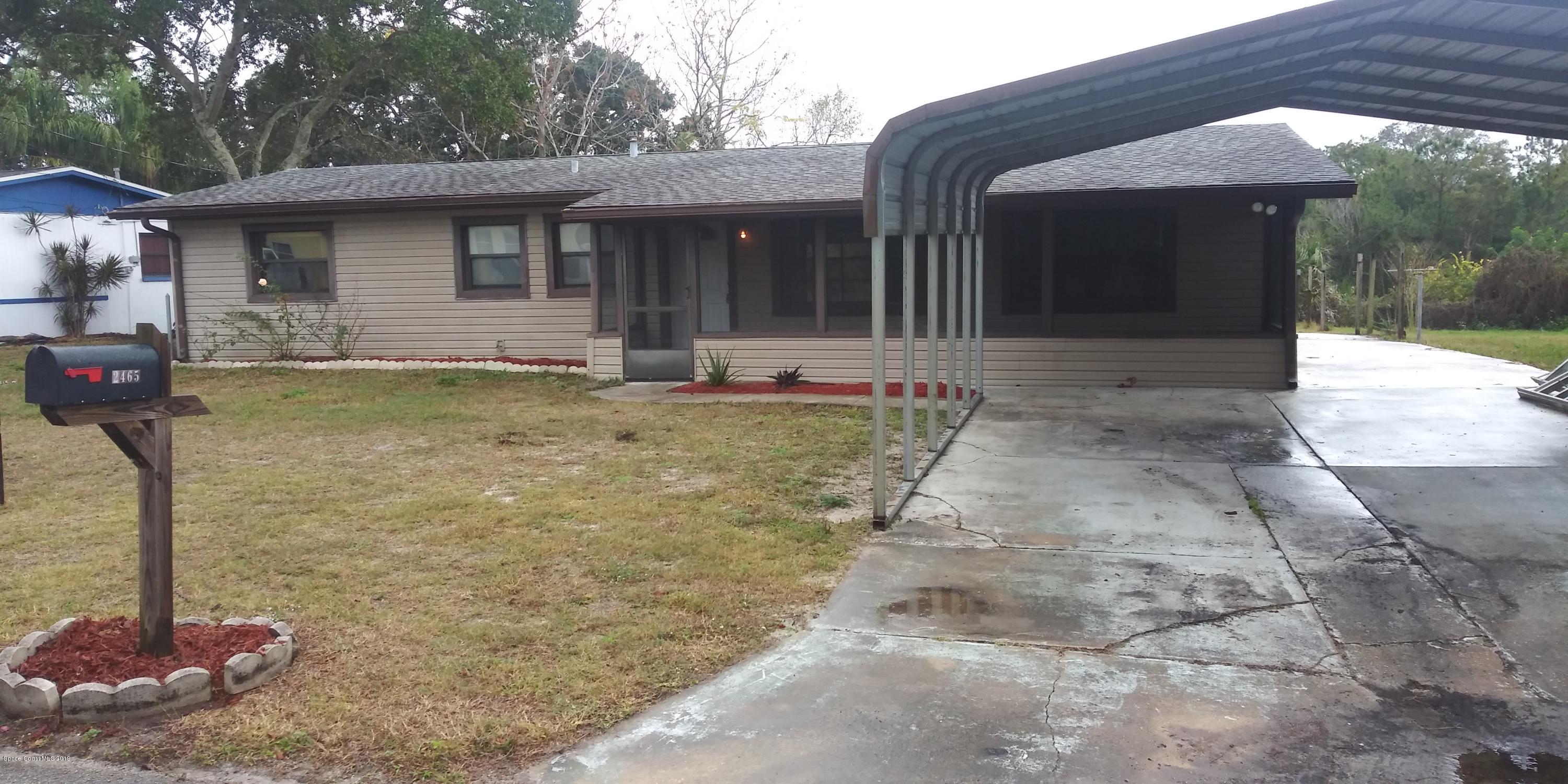 2465 Dolphin Road Titusville, FL 32780 - Photo 2 of 40 a view of a house with backyard