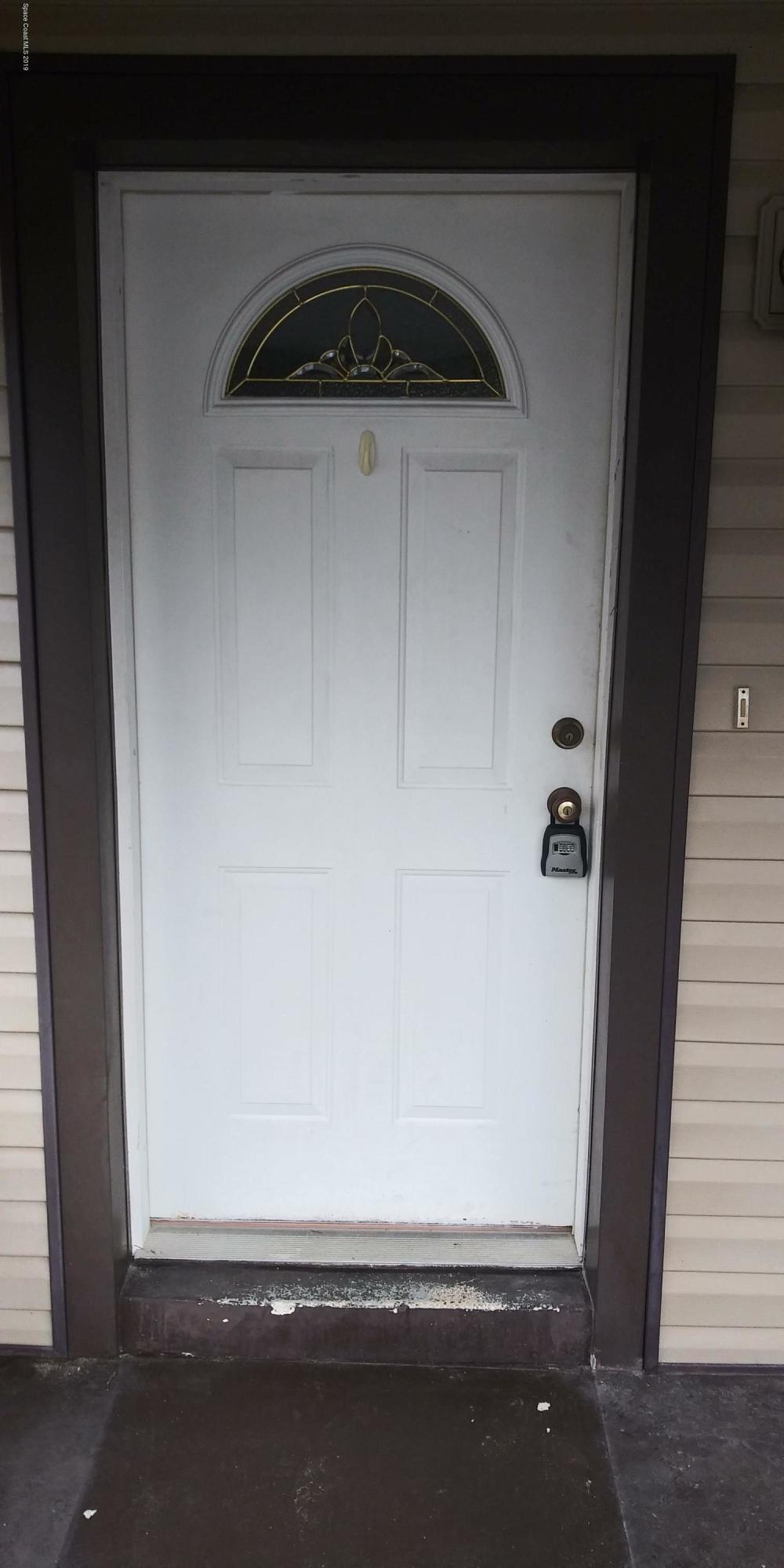 2465 Dolphin Road Titusville, FL 32780 - Photo 11 of 40 a view of a door of a house