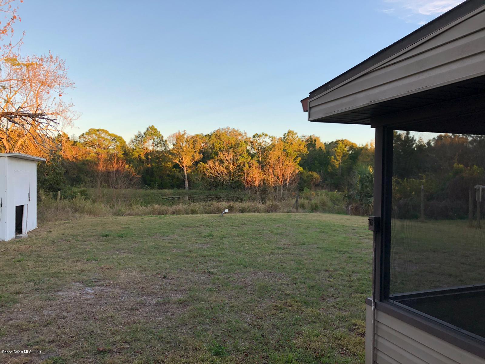 2465 Dolphin Road Titusville, FL 32780 - Photo 15 of 40 a view of a backyard