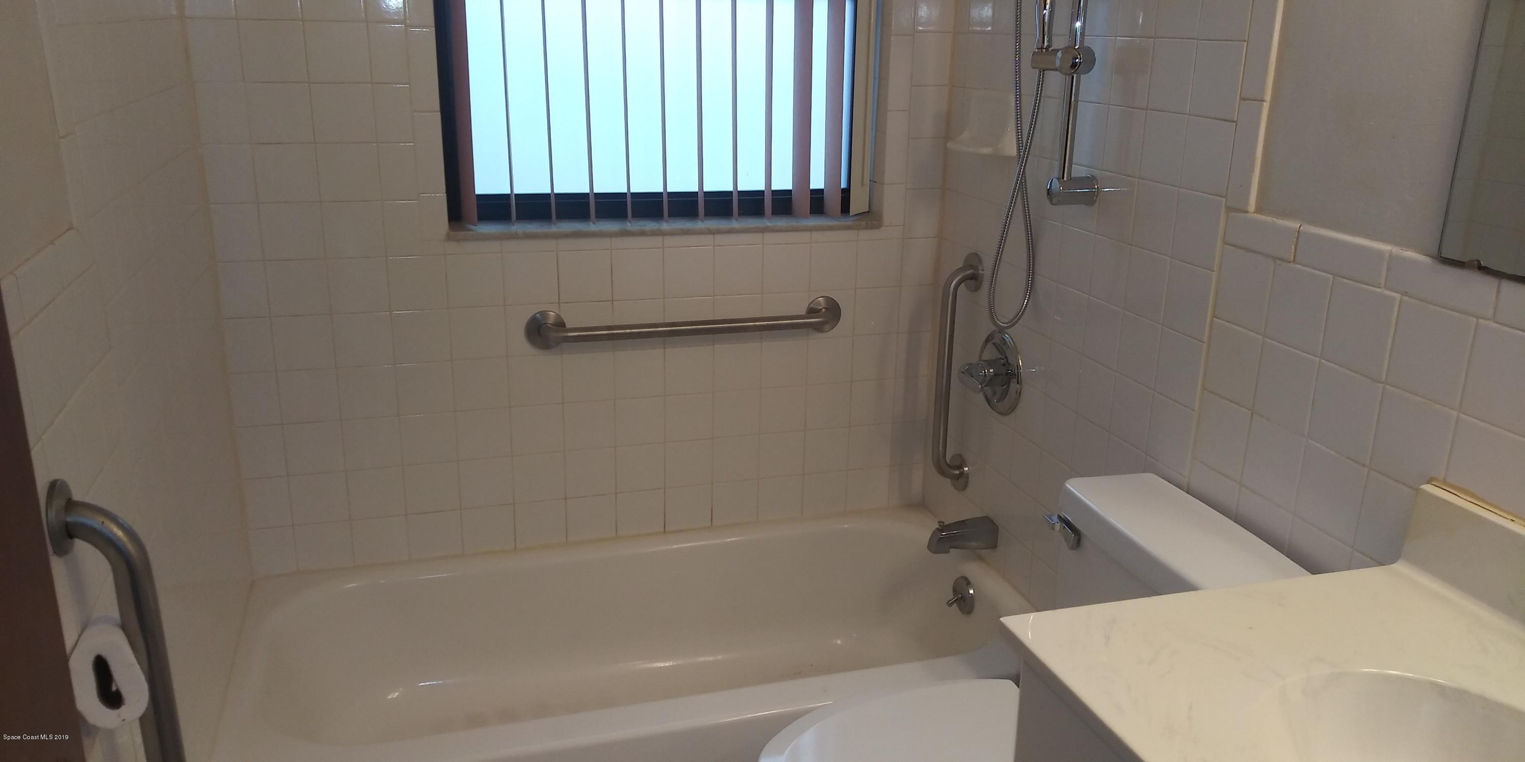 2465 Dolphin Road Titusville, FL 32780 - Photo 25 of 40 a bath room with a toilet