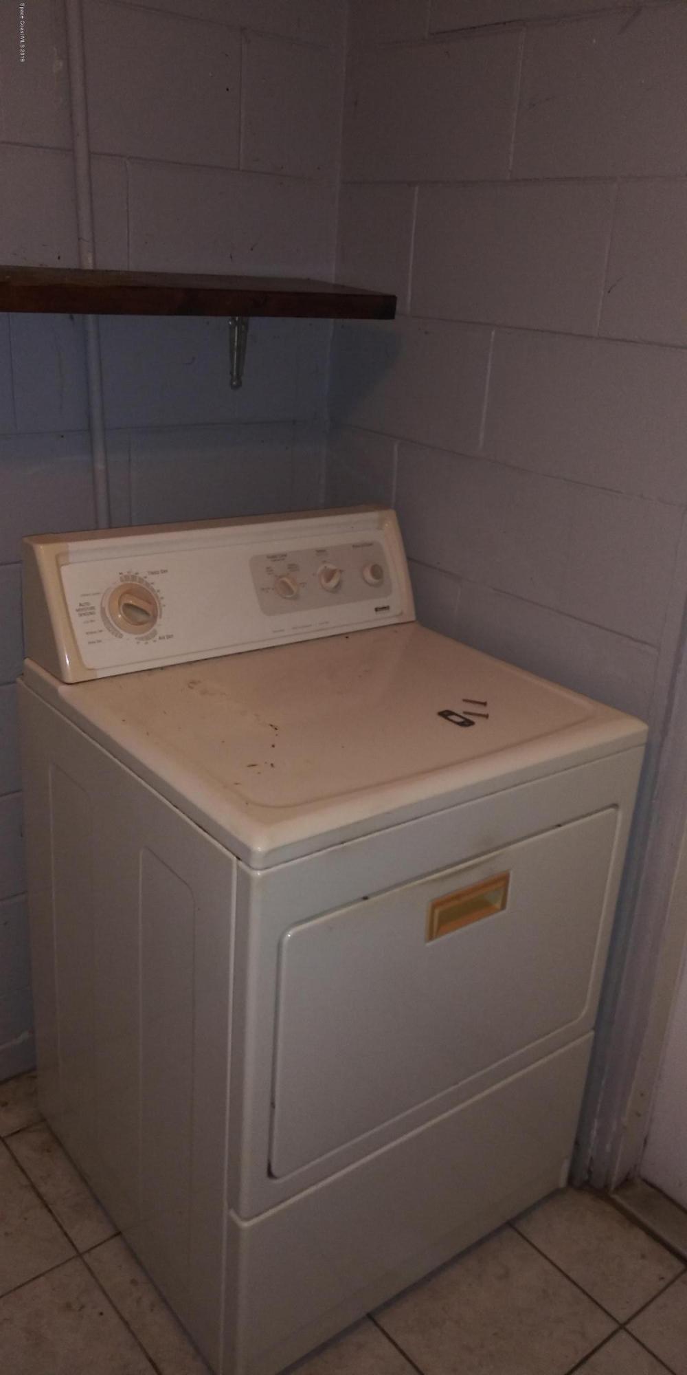 2465 Dolphin Road Titusville, FL 32780 - Photo 28 of 40 a utility room with dryer and washer