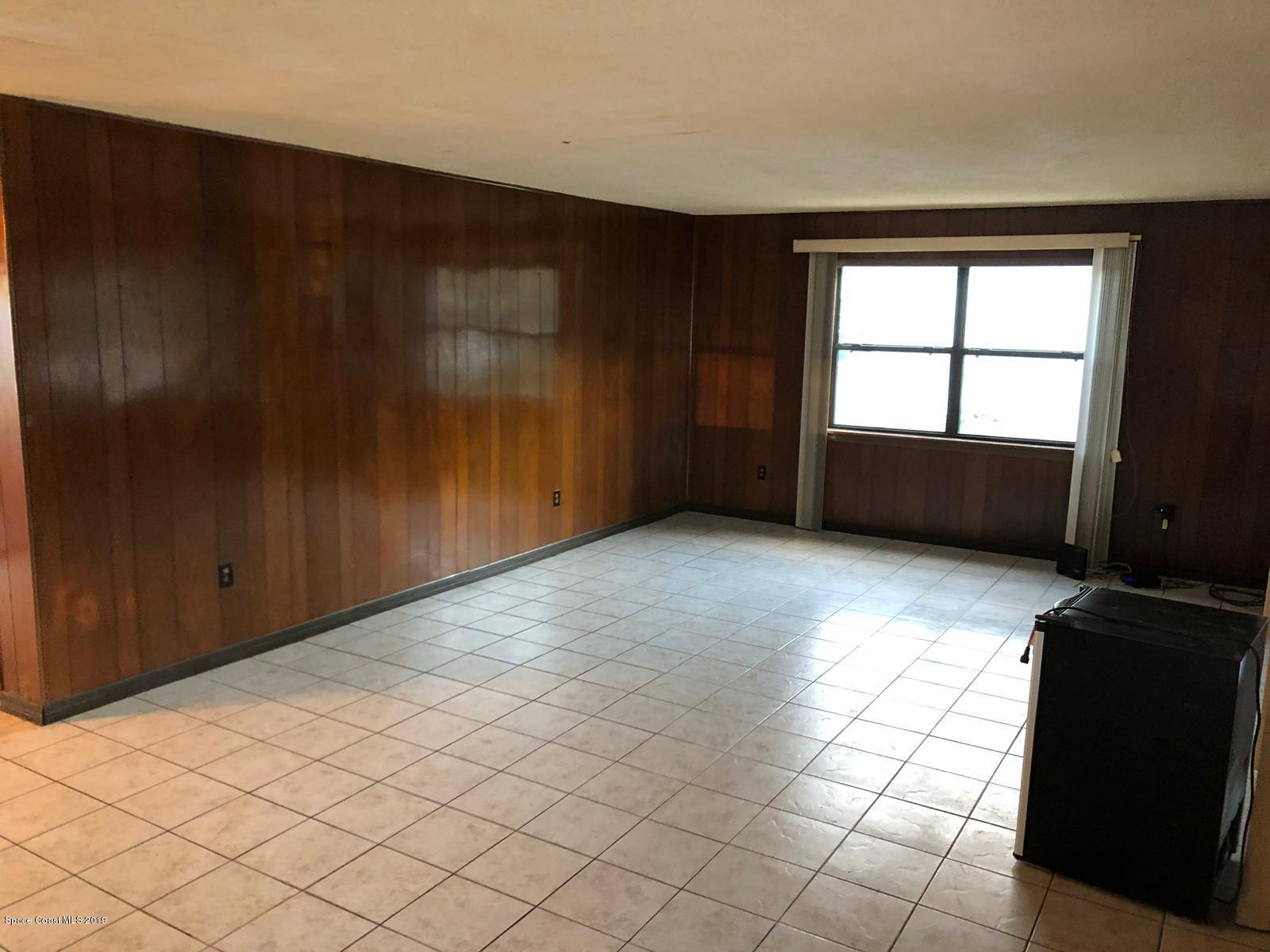 2465 Dolphin Road Titusville, FL 32780 - Photo 32 of 40 an empty room with windows