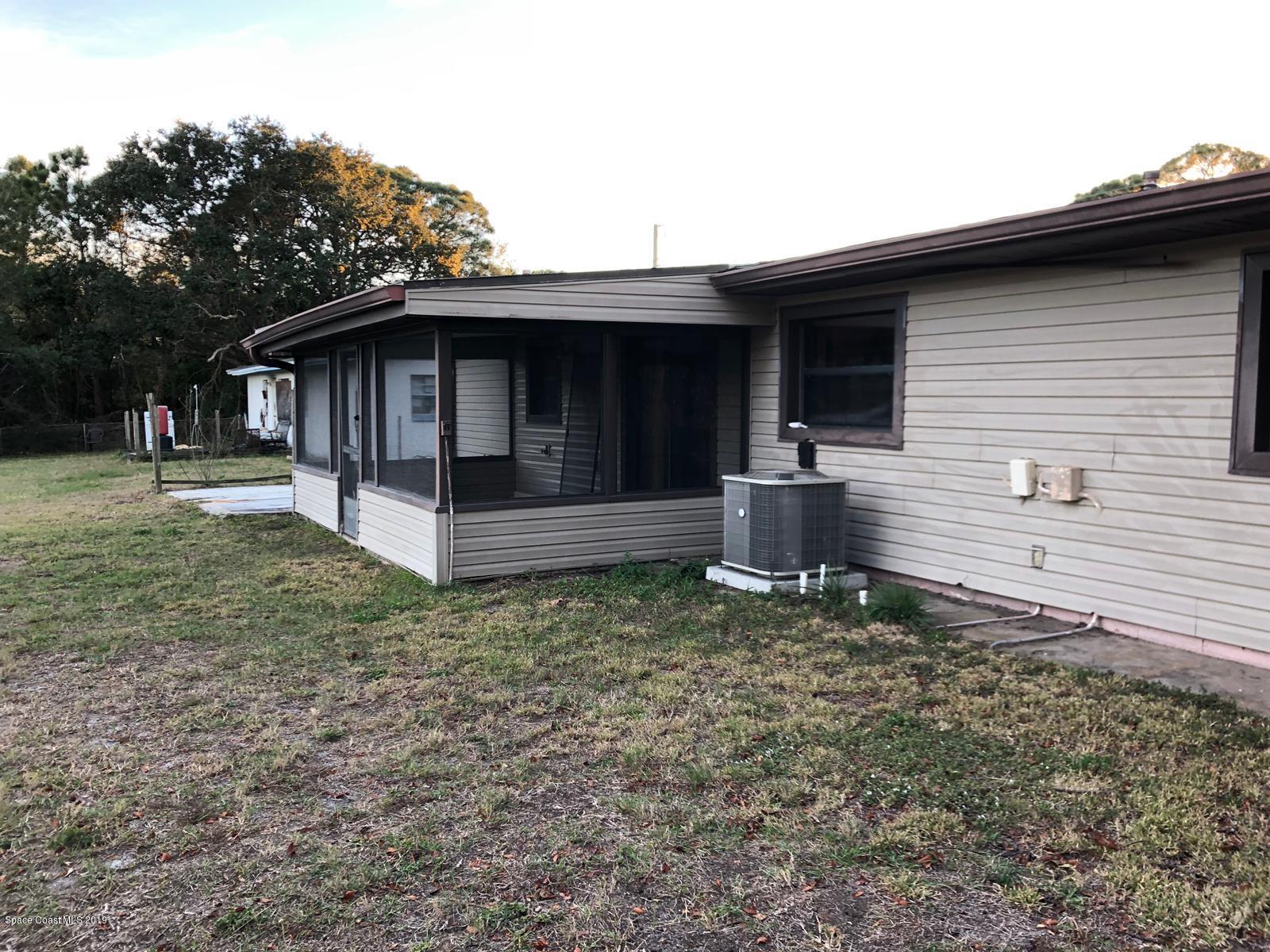 2465 Dolphin Road Titusville, FL 32780 - Photo 39 of 40 a view of a house with a yard