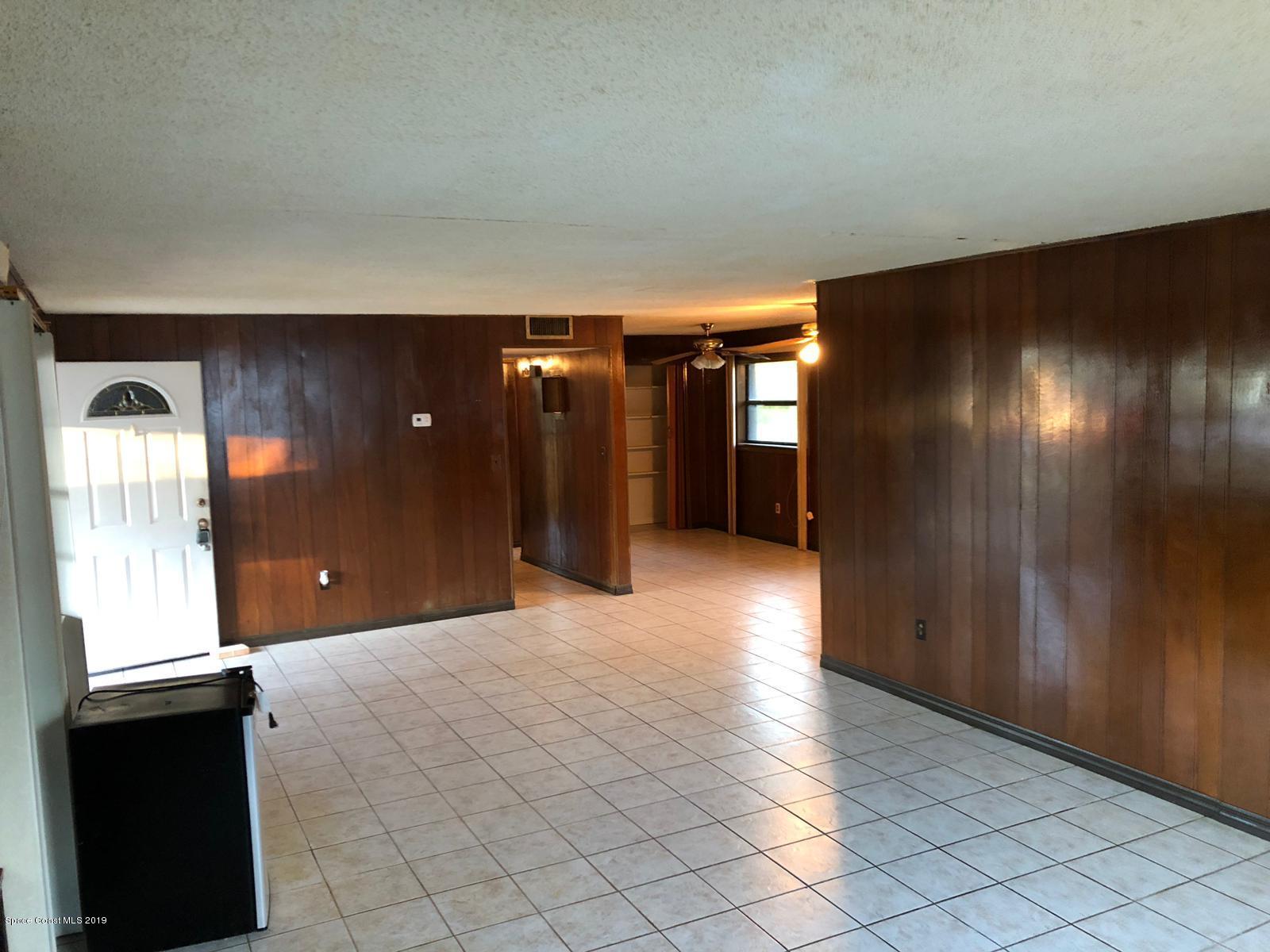 2465 Dolphin Road Titusville, FL 32780 - Photo 5 of 40 a view of gallery with wooden floor