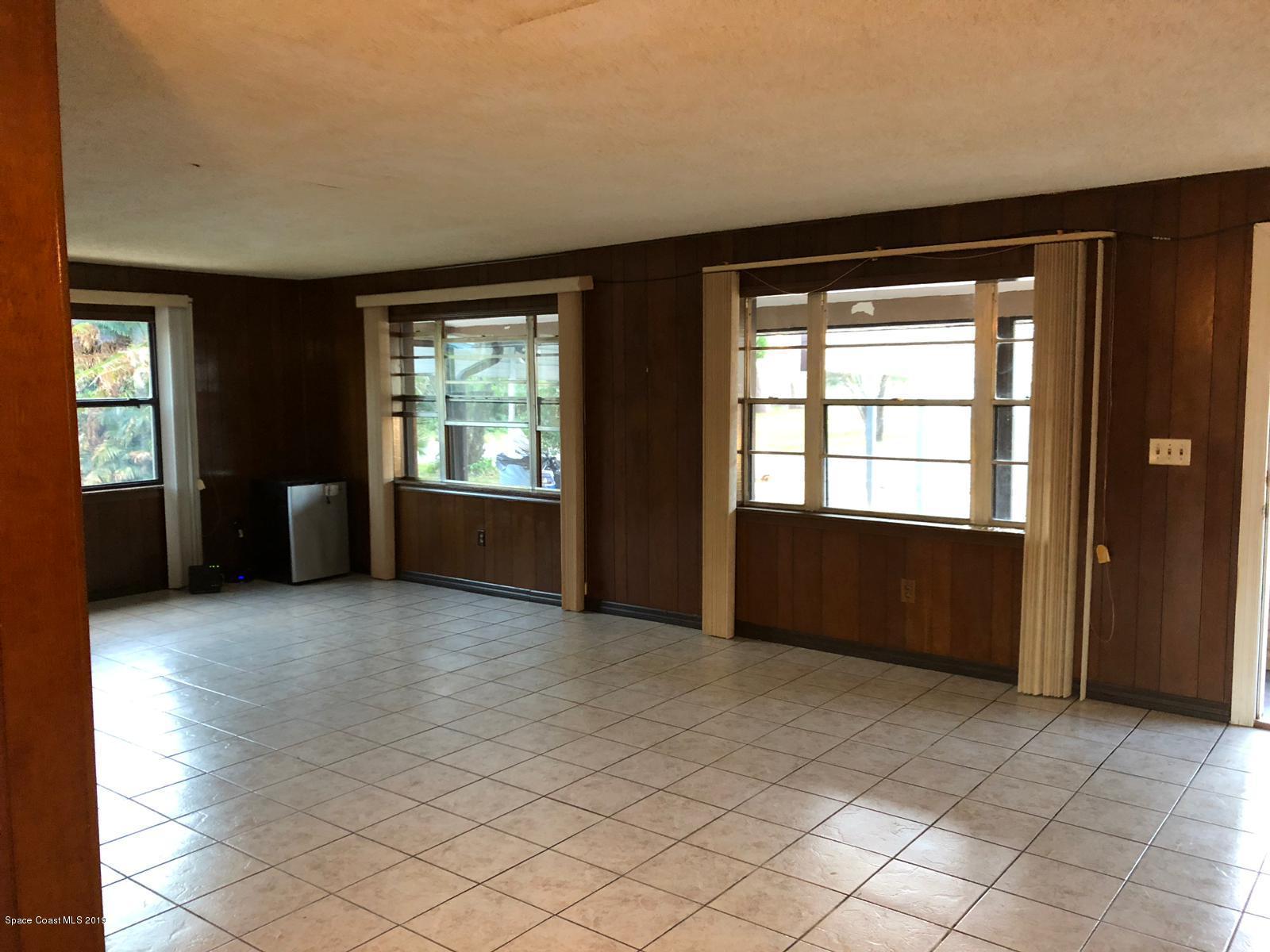 2465 Dolphin Road Titusville, FL 32780 - Photo 10 of 40 an empty room with windows