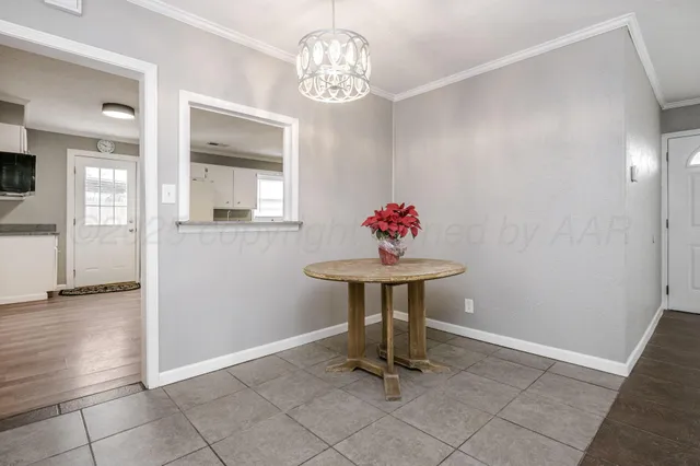 a view of kitchen with a sink a refrigerator and wooden floor