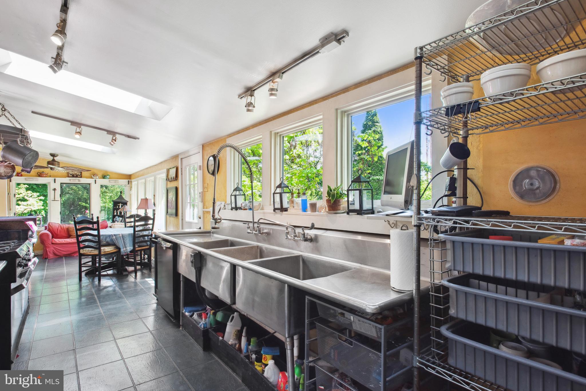 38 Old Lancaster Road Devon, PA 19333 - Photo 12 of 32 a kitchen that has a lot of cabinets in it