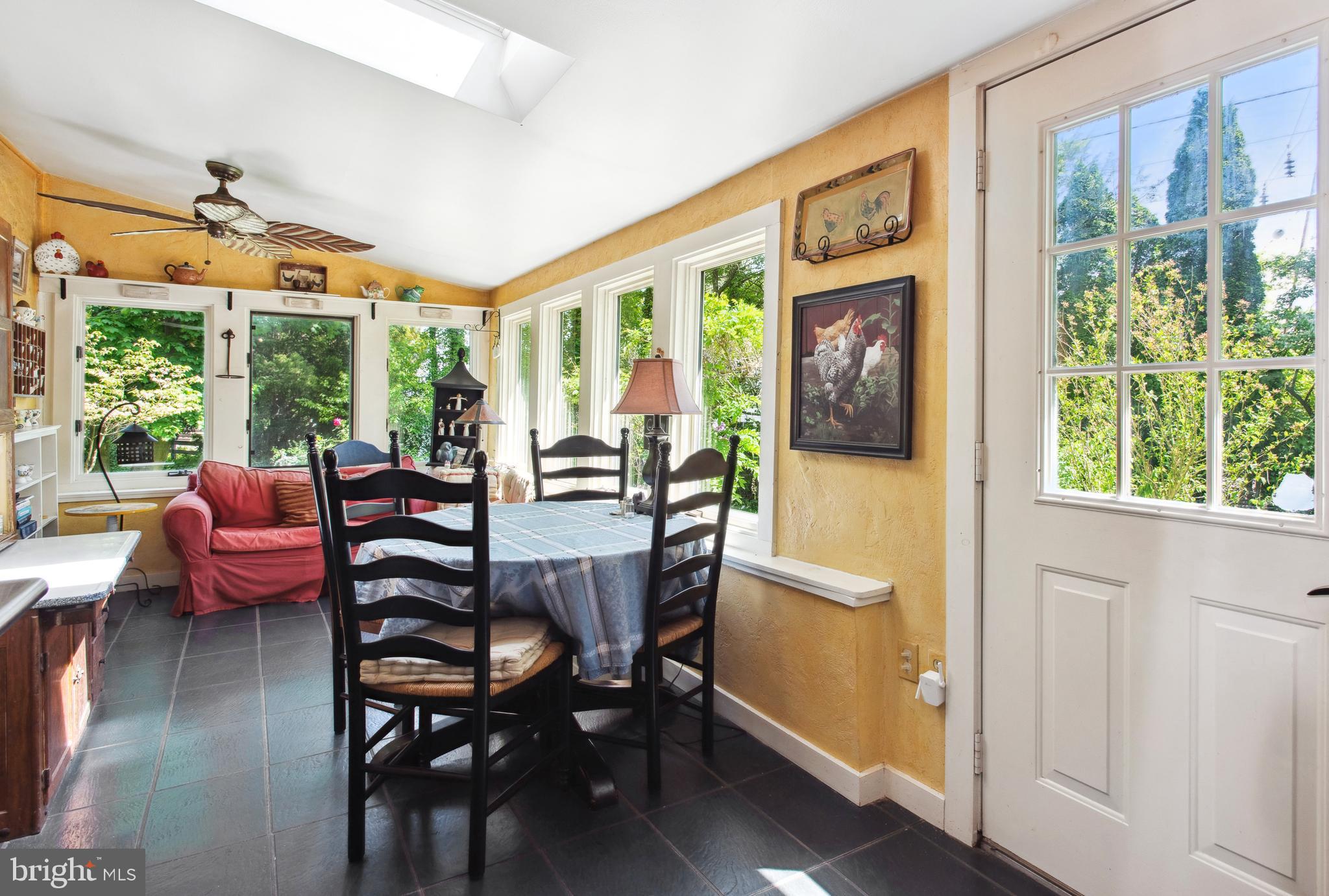 38 Old Lancaster Road Devon, PA 19333 - Photo 14 of 32 a dining room with furniture a flat screen tv and floor to ceiling windows