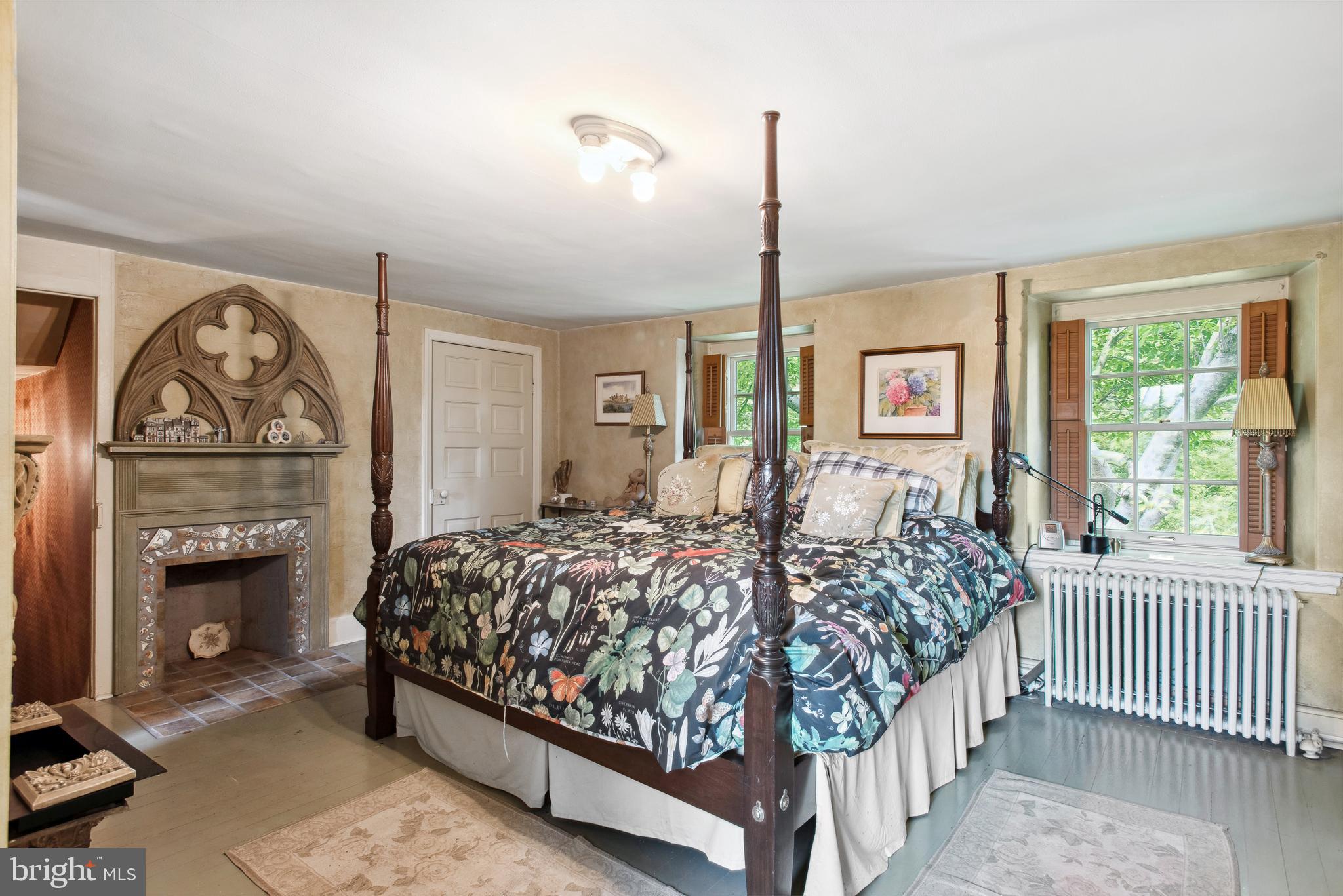 38 Old Lancaster Road Devon, PA 19333 - Photo 22 of 32 a bedroom with bed and a fireplace