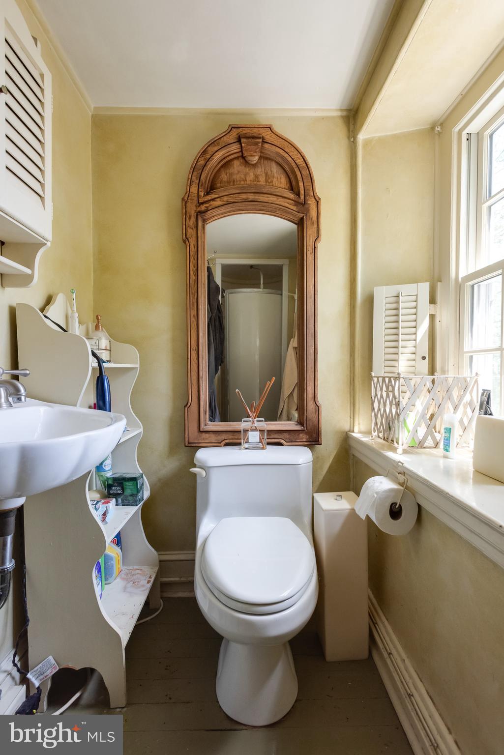 38 Old Lancaster Road Devon, PA 19333 - Photo 24 of 32 a bathroom with a toilet sink and mirror