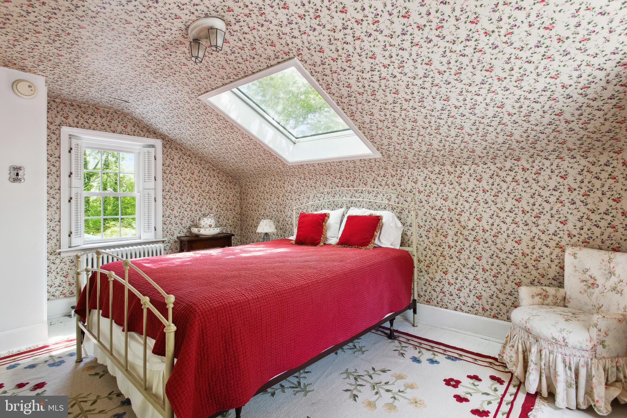 38 Old Lancaster Road Devon, PA 19333 - Photo 29 of 32 a bedroom with a bed and a table