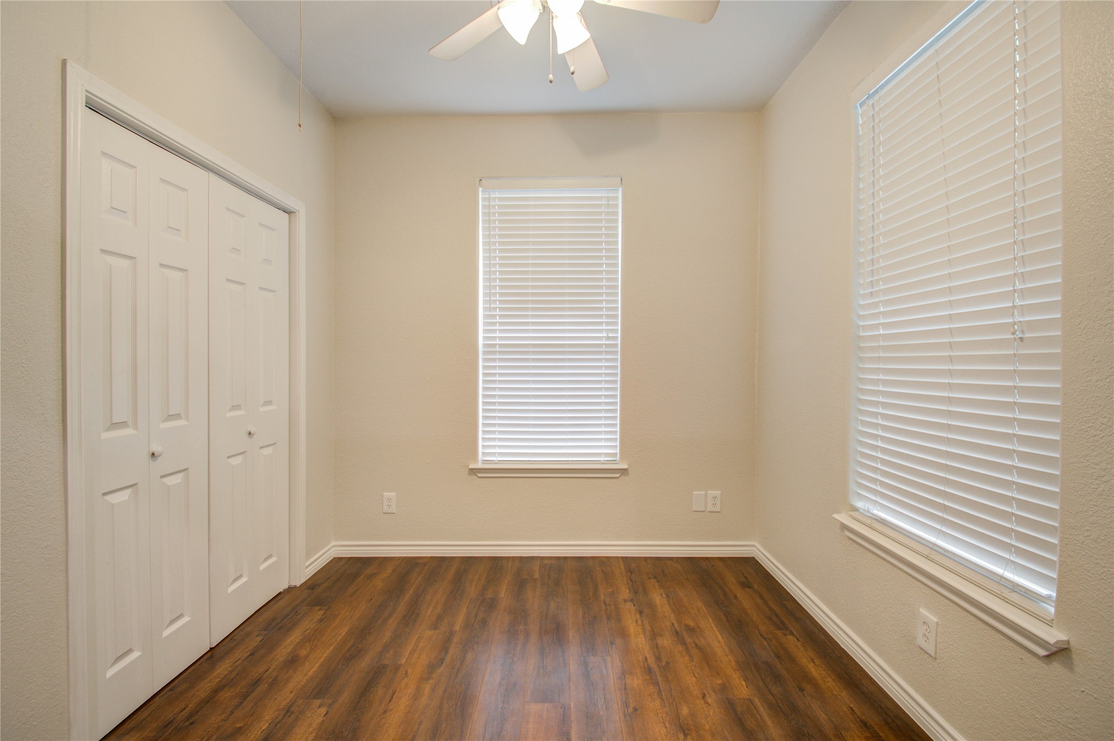 2119 Kane Street Houston, TX 77007 - Photo 11 of 29 a view of an empty room with wooden floor and a window