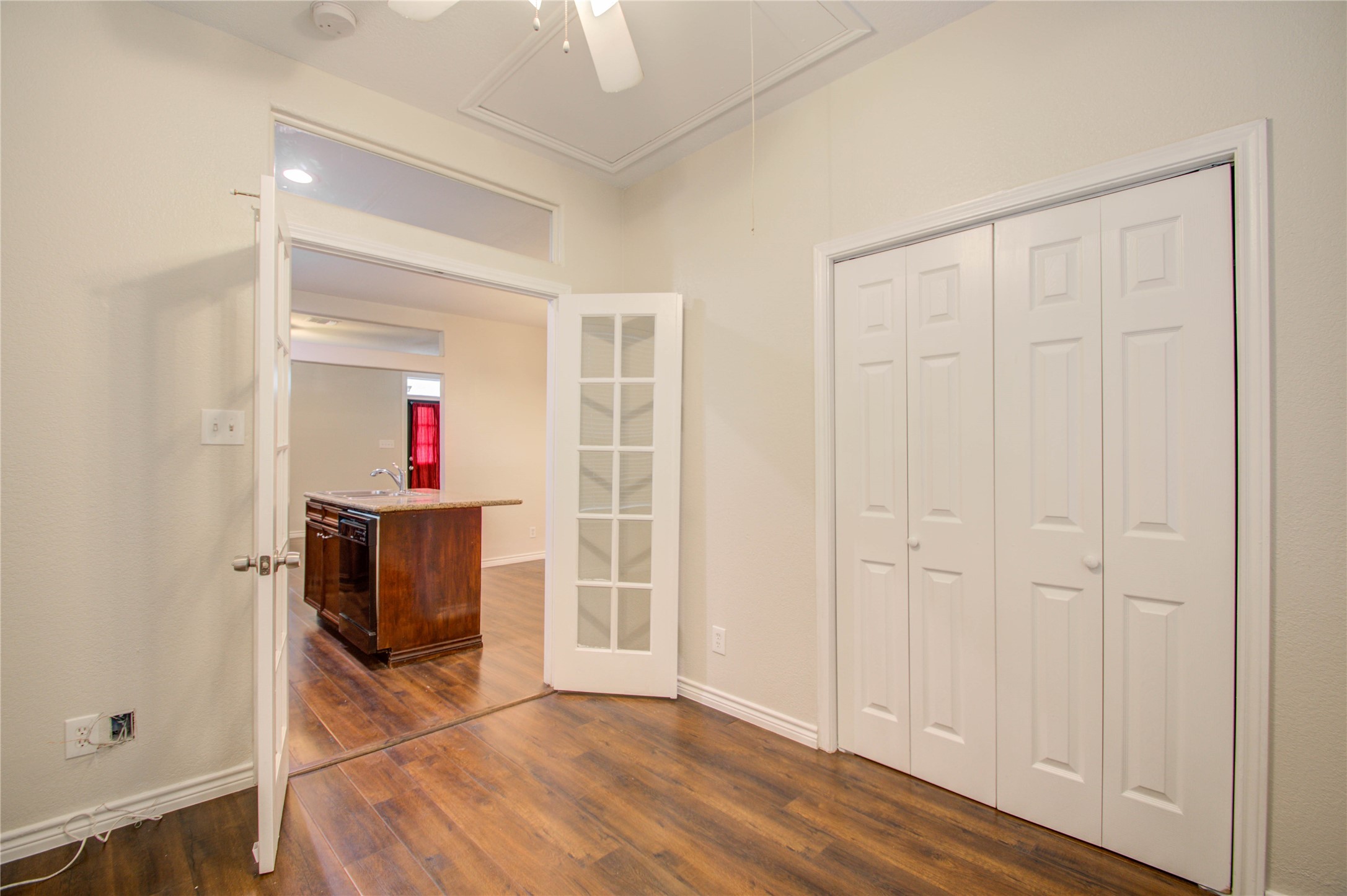 2119 Kane Street Houston, TX 77007 - Photo 22 of 29 an empty room with wooden floor and windows
