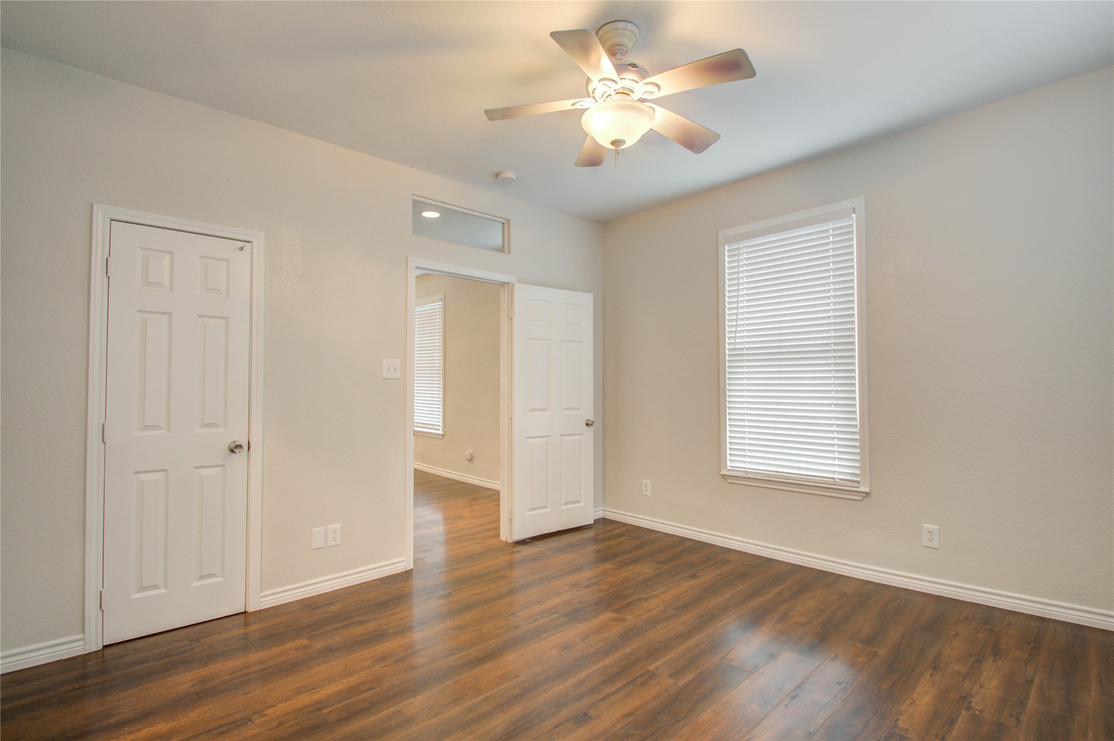 2119 Kane Street Houston, TX 77007 - Photo 25 of 29 an empty room with wooden floor and window
