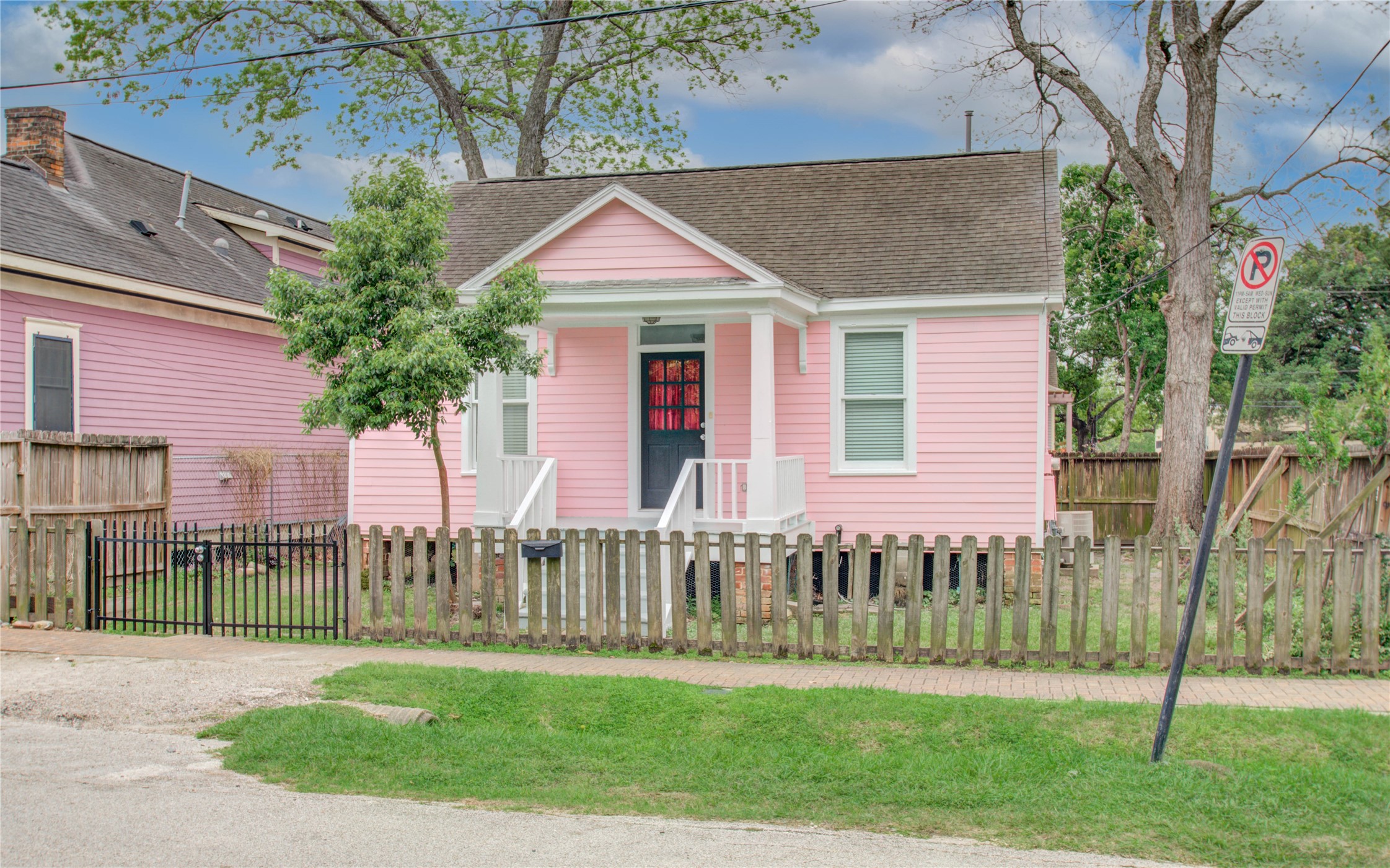 2119 Kane Street Houston, TX 77007 - Photo 3 of 29 a front view of a house with a garden and deck