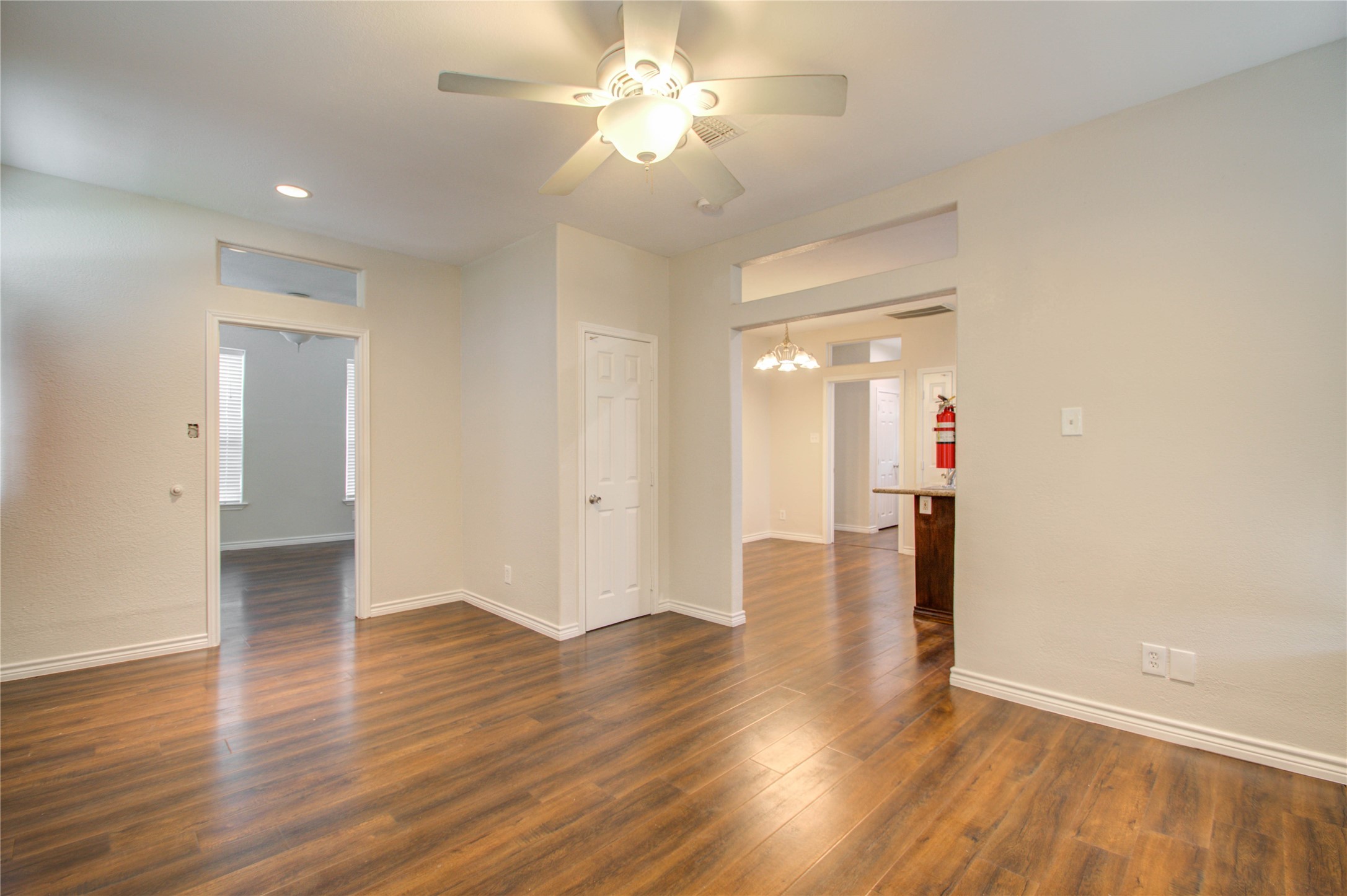 2119 Kane Street Houston, TX 77007 - Photo 6 of 29 a view of a room with wooden floor and a ceiling fan