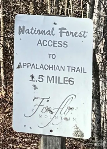 a view of a backyard with sitting area