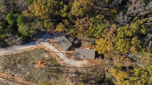an aerial view of residential house with outdoor space