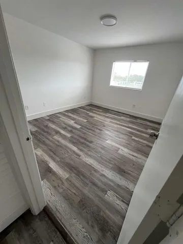 a view of an empty room and window