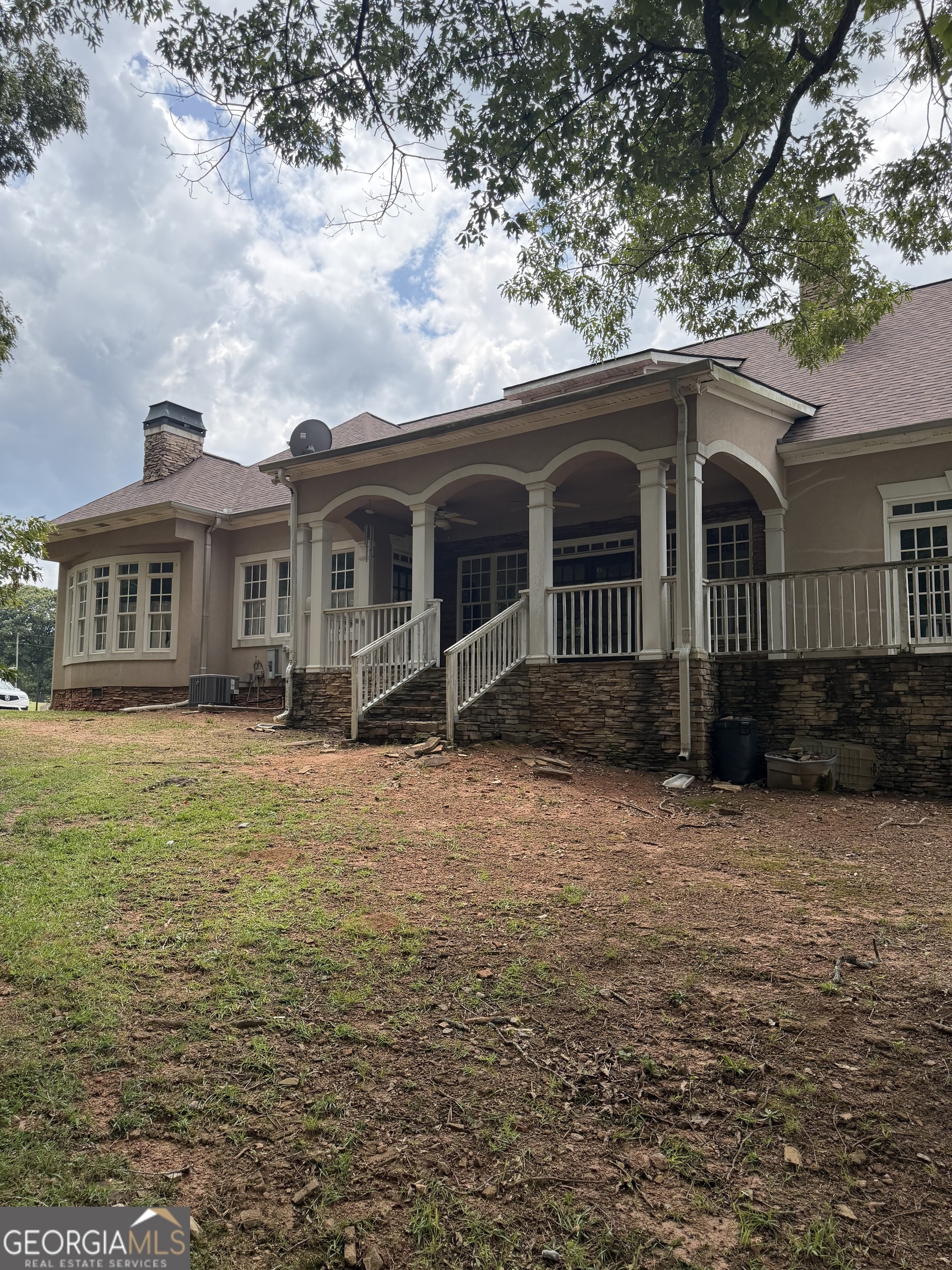 302 Norris Road Barnesville, GA 30204 - Photo 12 of 65 a front view of a house with a garden