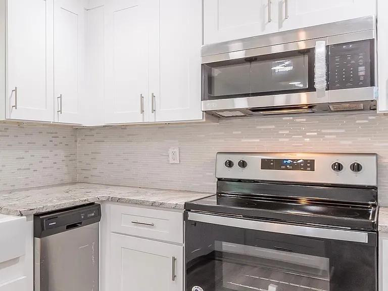 2077 Green Forrest Drive Decatur, GA 30032 - Photo 12 of 21 a kitchen with a stove and a microwave