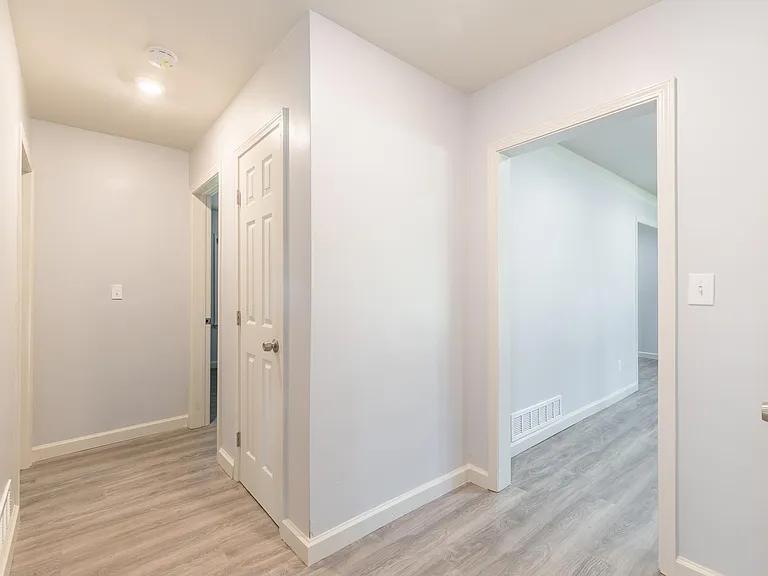 2077 Green Forrest Drive Decatur, GA 30032 - Photo 21 of 21 a view of hallway with closet and wooden floor