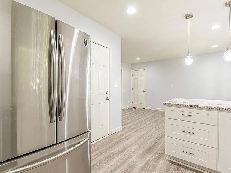 2077 Green Forrest Drive Decatur, GA 30032 - Photo 5 of 21 a view of cabinets with wooden floor