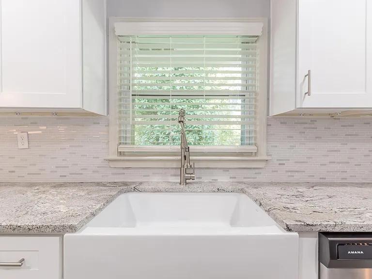 2077 Green Forrest Drive Decatur, GA 30032 - Photo 7 of 21 a bathroom with granite countertop a sink and bathtub