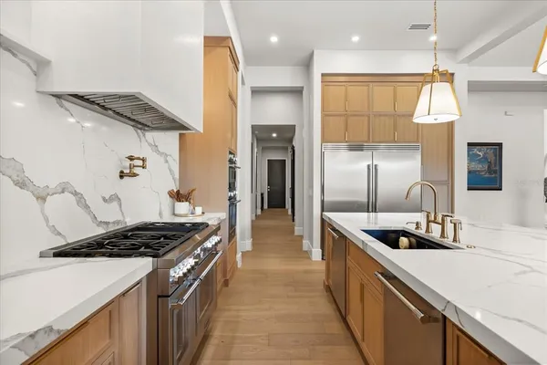 a kitchen with a sink cabinets and window