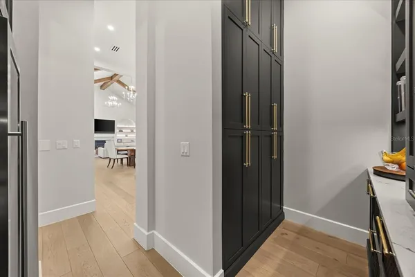 a spacious bedroom with a bed and large windows