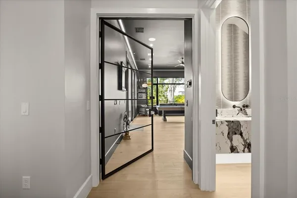 a spacious bathroom with a tub sink and mirror
