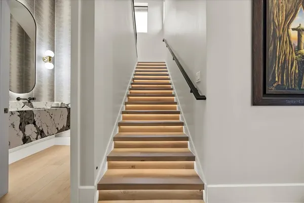 a spacious bedroom with a large bed and a flat screen tv