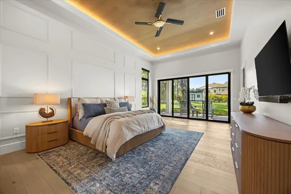 a living room with furniture and floor to ceiling window or shelf