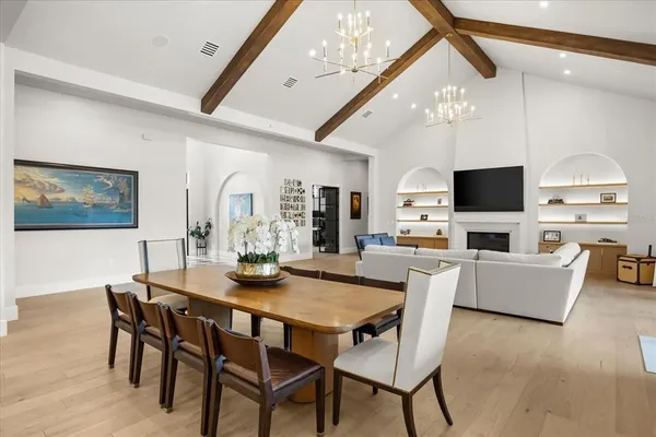 a kitchen with stainless steel appliances granite countertop a sink stove and wooden floor