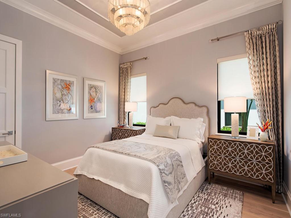 16868 Brightling Way Naples, FL 34110 - Photo 20 of 35 a bedroom with a bed and a window